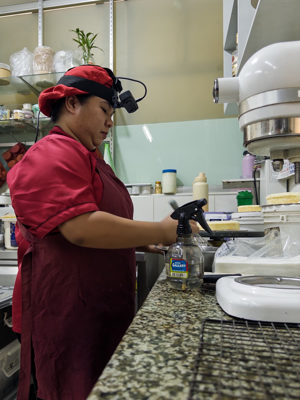 A Luckey collector wearing a head-mounted camera while working in a bakery